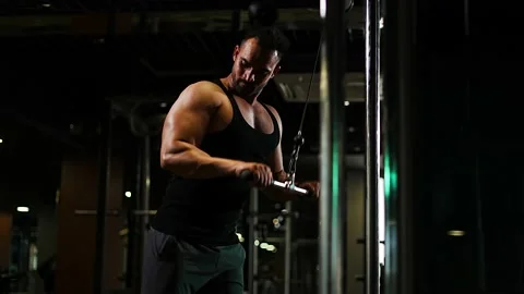 Professional athlete bodybuilder working out in the indoor gym. weight liftin Stock Footage 162655915