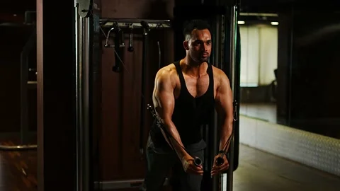 Professional athlete bodybuilder working out in the indoor gym. weight liftin Stock Footage 162655953
