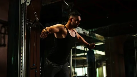 Professional athlete bodybuilder working out in the indoor gym. weight liftin Stock Footage 162656039