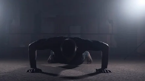 Professional athlete doing push-ups in gym. Boxer training in elastic bandages Stock Footage 96929419