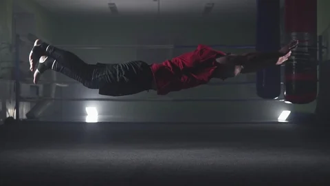 Professional athlete doing push-ups in gym. Boxer training in slow motion 스톡 동영상 110437624