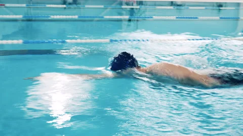 Professional athlete performing breaststroke in a pool Stock Footage 150793369