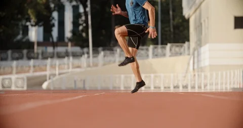 Professional athlete warming up at start of his training in morning, preparing Stock-Footage 117537331