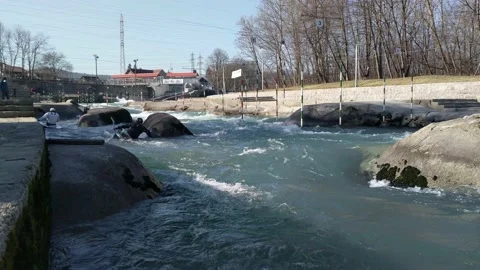 Professional athletes training on river rapids in kayak and canoe Stock Footage 149857767