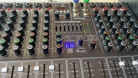 Professional Audio Mixer Console with Knobs and Faders Close-Up Vídeo Stock 332582892