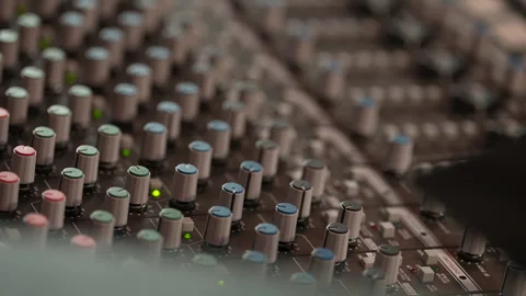 Professional audio mixing console close-up with rack focus Video stock 331417940