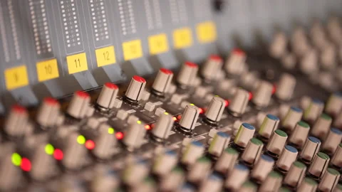 Professional audio mixing console close-up with rack focus Video stock 331417941