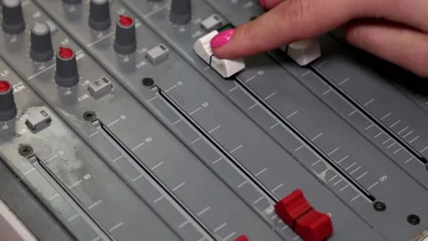 Professional audio mixing console with faders and adjusting knobs. 스톡 동영상 90086793