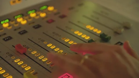 Professional audio mixing console with faders raising volume Stock Footage 114582271