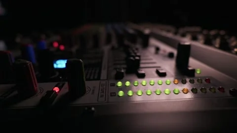 Professional Audio Mixing Console with Glowing Led Level Meters Control Knobs Stock-Footage 334736794