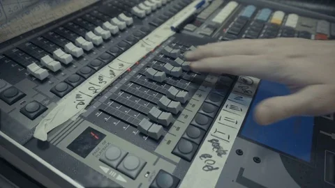 Professional audio operator working on audio mixer knobs 스톡 동영상 70602224