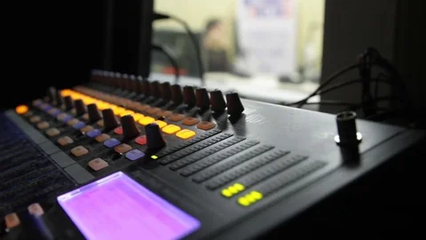Professional audio operator working on audio mixer knobs during live TV telecast Stock Footage 82860080
