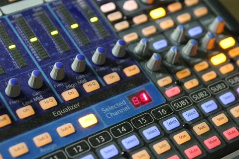 Professional audio operator working on audio mixer knobs during live TV telec Stock Photos