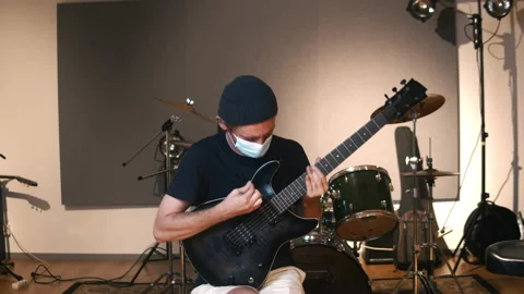 Professional audio studio. Man playing guitar. Life of musicians across the Stock Footage 138389020