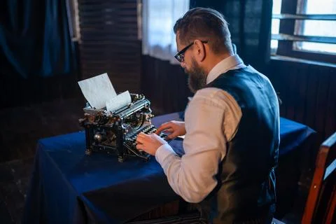 Professional author working on a typewriter Stock Photos