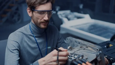 Professional Automotive Engineer in Glasses with a Computer and Inspection Tools Video stock 105850214