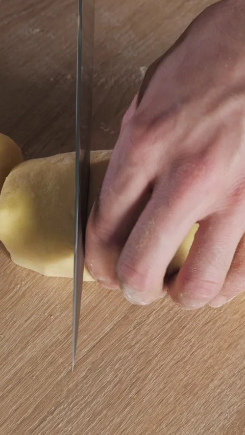 Professional baker cutting dough for cinnamon rolls Stock Footage 341433124