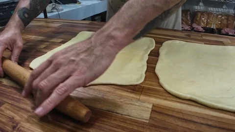 Professional Baker Hand-Rolling Dough to Stuff Bread Stock Footage 337865039