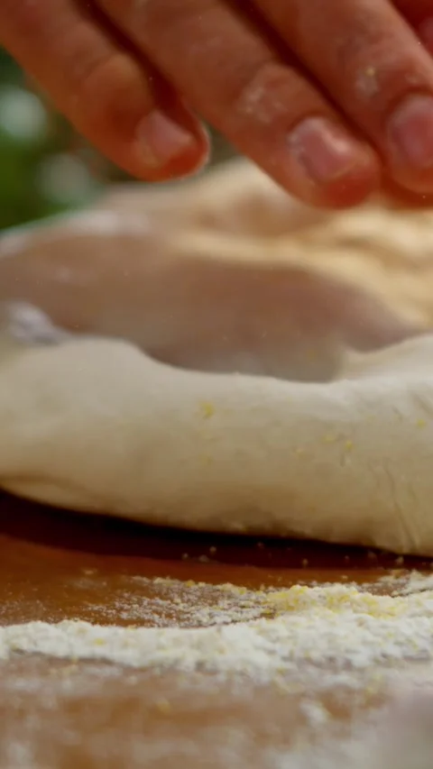 Professional baker hands kneading and rolling soft bread dough on floured w.. Stock Footage 337522987