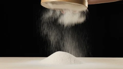 Professional baker hands sift flour through a wooden sieve on the table Video stock 126368581