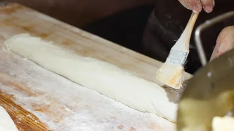 Professional Baker Kneading and Brushing Flour on Bread Dough Stock Footage 341373901