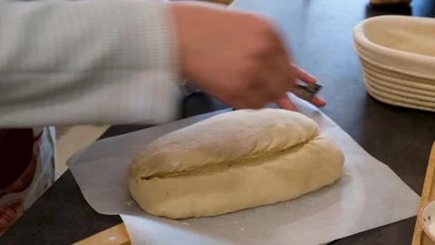 Professional Baker Shaping and Scoring Fermented Dough Stock Footage 340653137