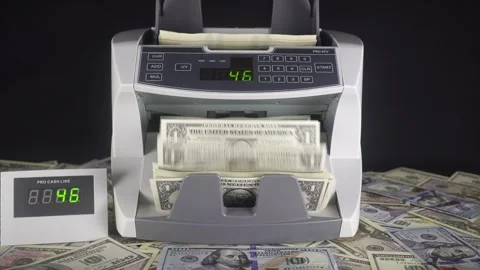 A Professional Banknote Counter Counts A Stack Of American Dollars. Stock Footage 322521489