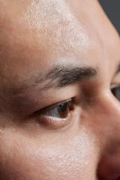 Professional barber doing threading procedure and correcting shape of eyebrows Stock Photos