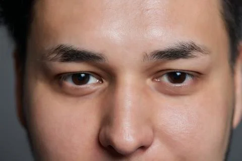 Professional barber doing threading procedure and correcting shape of eyebrows Stock Photos