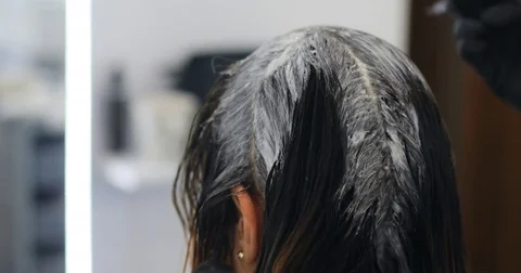 Professional barber hairdresser dyeing coloring hair brush woman girl getting Stock Footage