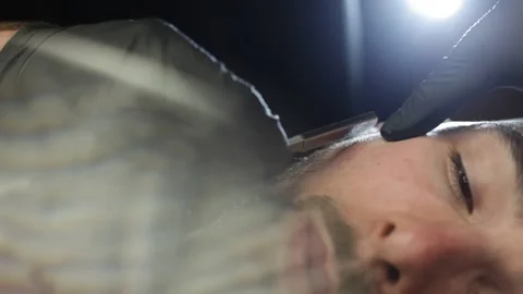 Professional Barber Shaves Customer Beard With Straight Razor. Stock Footage 139765237
