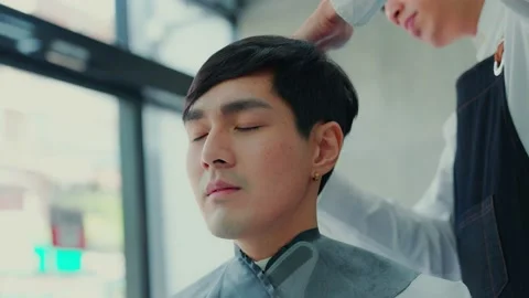 Professional barber uses scissors to cut the back of the occiput to male clie 스톡 동영상 153967258