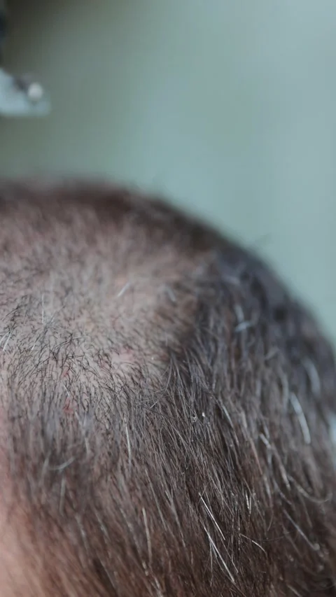 Professional barber using a clipper for a haircut and grooming routine. Clo.. Stock Footage 343532377