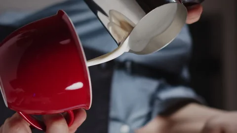 Professional barista making cafe latte art. Vertical video for smartpone and web Video stock 168445205