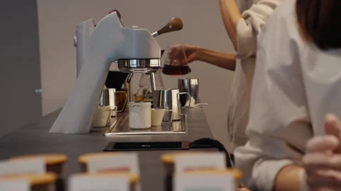 Professional barista preparing espresso with a modern coffee machine Stock Footage 325192538