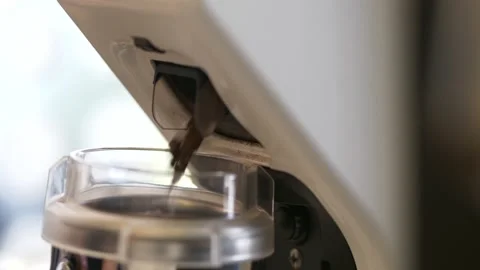 Professional barista worker use grinder machine to grind fresh coffee beans Stock Footage 167013032