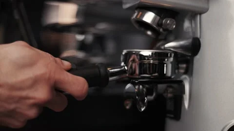Professional barista worker use grinder machine to grind fresh coffee beans Stock Footage 188904318