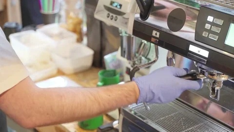 Professional barista, working at the bar. Making coffee in the coffee machine Stock Footage 81150311
