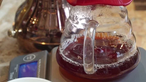 Professional barista, working at the bar. Making filter coffee machine. Drops Stock Footage 81636812