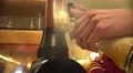 Professional barman pouring beer in glass at pub, serving drink to clients 4k or 4k+ Resolution