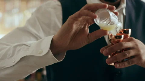 Professional bartender adding lemon juice into shaker to make classic Daiquiri c Stock Footage 199455554
