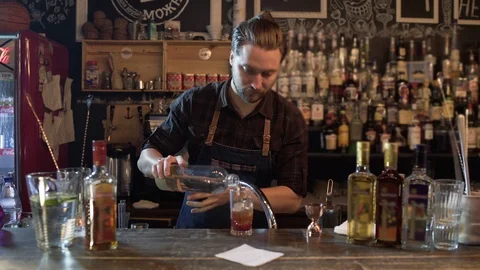 Professional bartender at bar, prepares fancy drink or cocktail 스톡 동영상 96145657