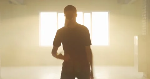 Professional bartender juggles bottles. The bartender is practice in hall at Video stock 154333391