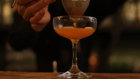 Professional Bartender Making Cosmopolitan Drink Stock Footage 129846436