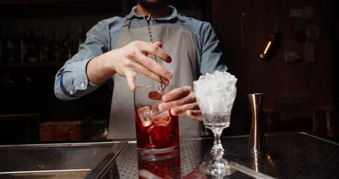 Professional bartender masterly creating a cocktail in modern bar. Experienced Stock-Footage 132970803