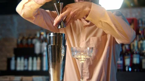 Professional bartender masterly creating a cocktail in modern bar. Stock Footage 239101114