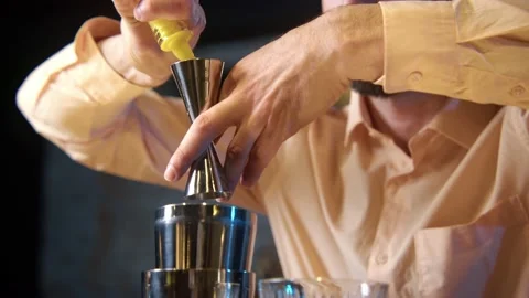 Professional bartender masterly creating a cocktail in modern bar. Stock Footage 239101234