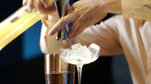 Professional bartender masterly creating a cocktail in modern bar. Video stock 239101803
