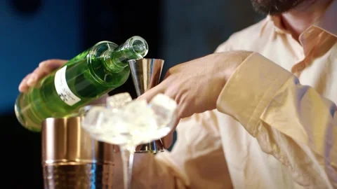 Professional bartender masterly creating a cocktail in modern bar. Stockbeeldmateriaal 239103707