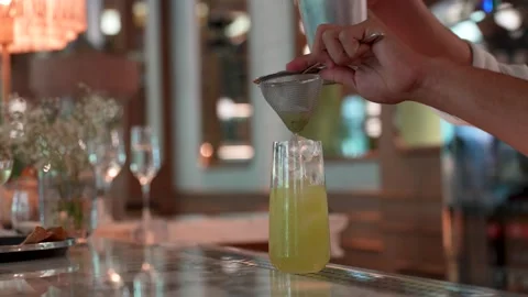 A professional bartender is preparing an alcoholic cocktail, close-up. Barm.. Stock Footage 282713613